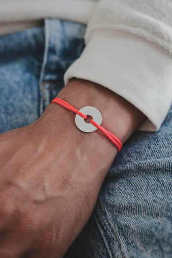 Bracelet La Cible en argent 925, cible ronde et cordon paracorde rouge