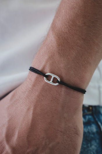 Bracelet ancre en argent 925 avec cordon noir et breloque ancre argentée.